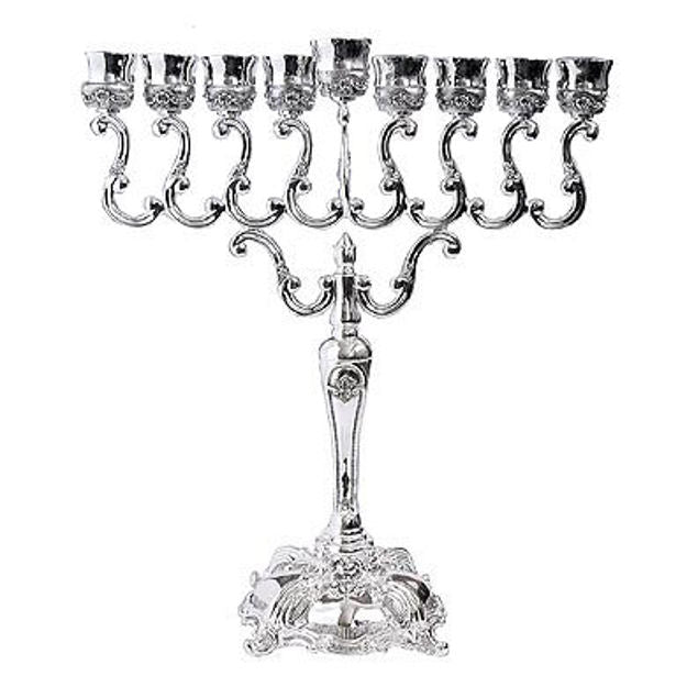 Large silver plated menorah with scrolling arms, tulip cups, raised shamash and square ornate base