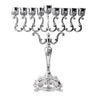 Large silver plated menorah with scrolling arms, tulip cups, raised shamash and square ornate base