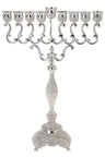 Tall silver plated menorah with S-scroll arms, fluted baluster stem and decorated footed base