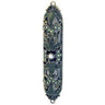 Dark jeweled mezuzah case with bronze-tone scroll openwork, small pale stones and a pearl-like center
