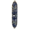Navy jeweled mezuzah case with bronze-tone scroll openwork, iridescent stones and a central pearl-like bead