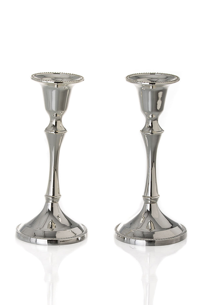 Two short polished silver plated candlesticks with beaded rims and round stepped bases
