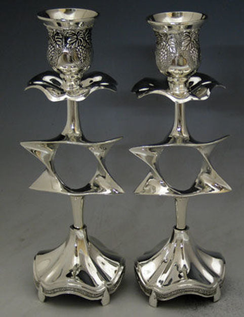 Pair of silver plated candlesticks with an open Star of David in each stem and embossed cups