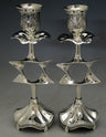 Pair of silver plated candlesticks with an open Star of David in each stem and embossed cups