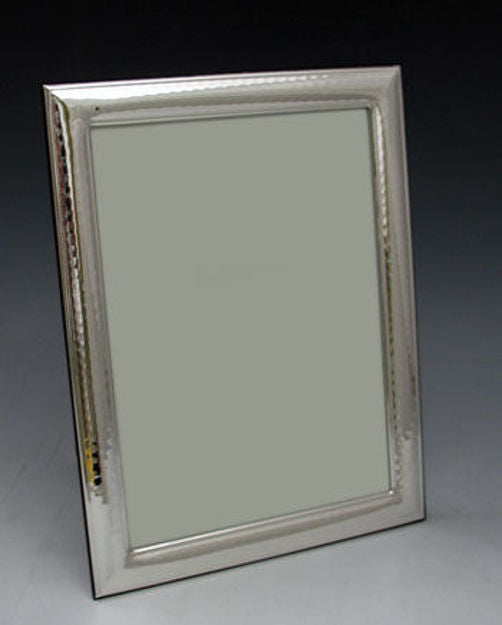 Upright 5x7 sterling silver picture frame with a textured inner border, angled against a dark background