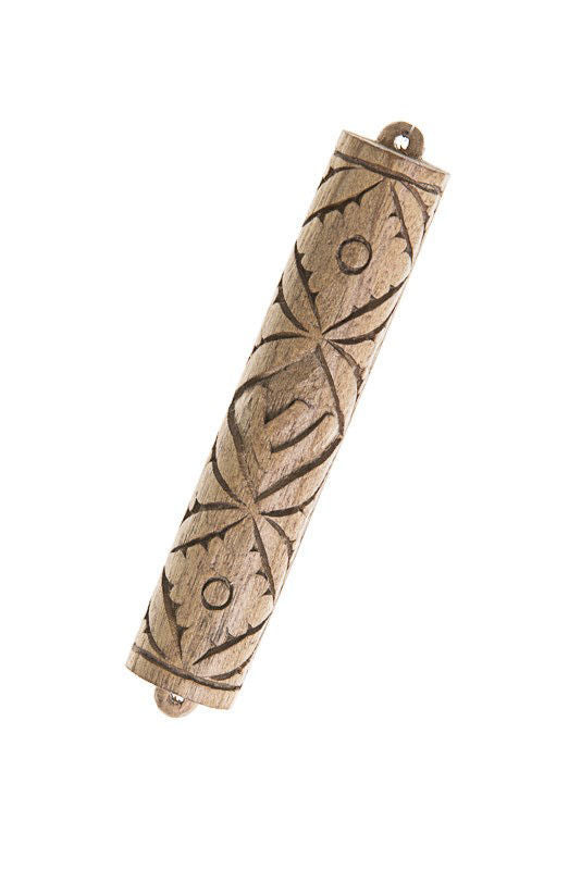 Light Cempaka wood mezuzah case carved with a repeating leaf and circle pattern