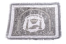White and silver-tone challah cover with an arch, crown, candlesticks, challah loaves, Hebrew text and fringed edge