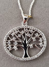 Oval Tree of Life pendant with CZ-set leaves and stone-lined rim hanging from a fine chain on grey