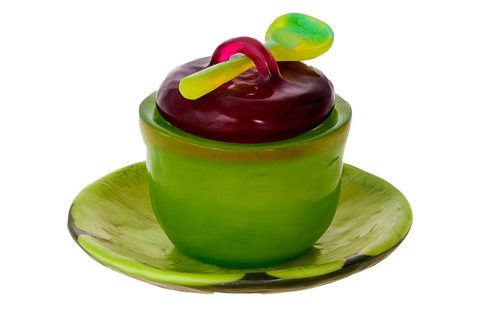 Lime green honey dish with cherry red lid, lime spoon and matching lime tray