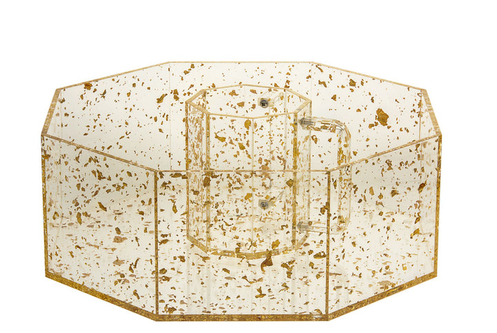 Octagonal clear Lucite bowl with gold flakes holding a matching gold-flecked wash cup in the center