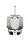 Clear crystal dreidel with silvertone engravings of Old Jerusalem on its sides, on crystal stand