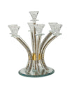 Seven-branch crystal candelabra with curved arms filled with crushed gold stones on a round mirror base