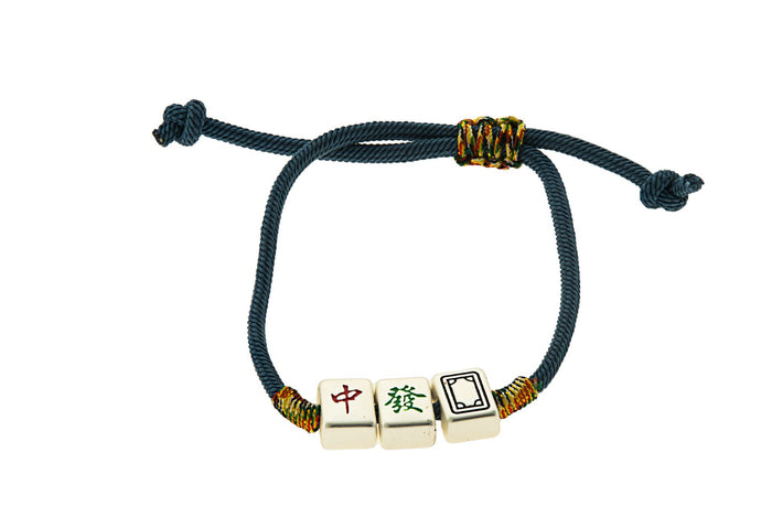 Navy rope bracelet with three small ivory Mah Jongg tile charms and multicolor thread wraps