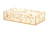 Rectangular clear lucite napkin holder with gold flakes suspended in the side panels