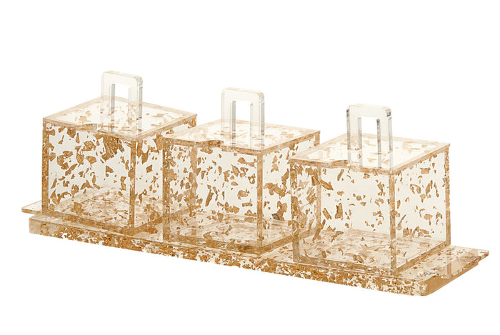 Three gold-flake Lucite cube dishes with clear loop-handled lids on a matching gold-flake tray