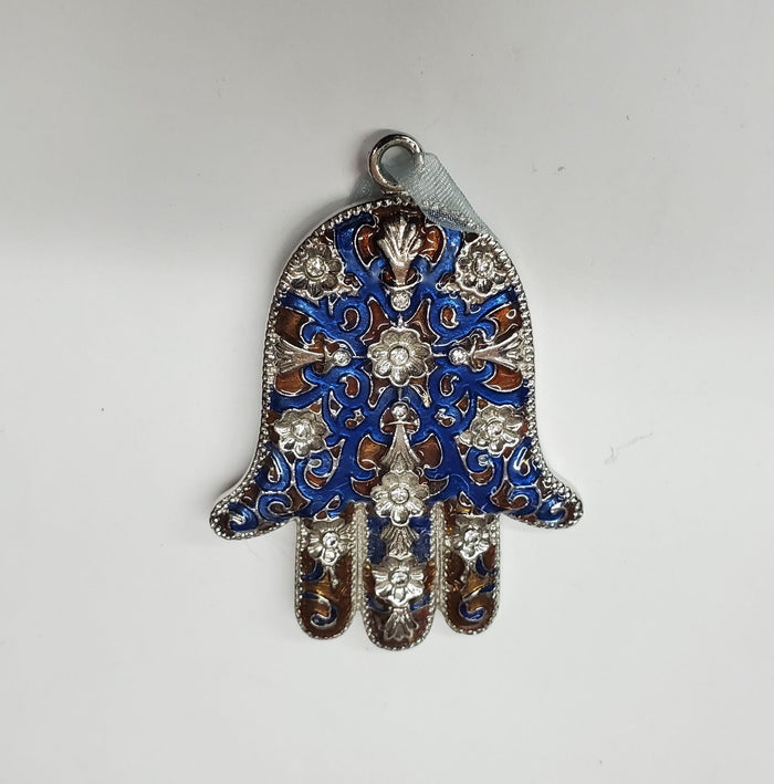 Blue and brown enamel hamsa with raised silver-tone flowers and a hanging loop at the top