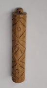 Teak wood mezuzah case with carved crisscross and circle pattern and a small hanging loop at top