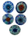Five round blue glass wall art discs with radiating lines, orange centers and one Star of David
