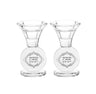 Two clear crystal candlesticks with round medallions engraved Shabbat V'Yom Tov in Hebrew
