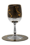 Stemmed kiddush cup in brown and gold enamel resting on its matching round tray
