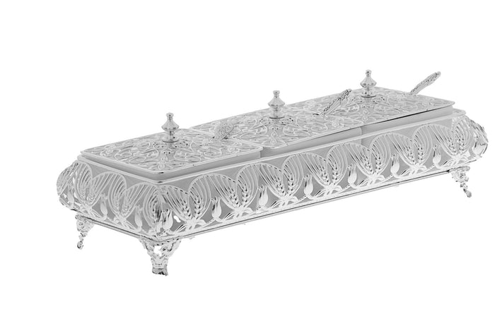 Footed silver plated filigree dish with three ornate lids, finials and a serving spoon