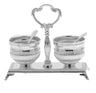 Pair of crystal salt and pepper shakers in a silver plated carrier with a handle