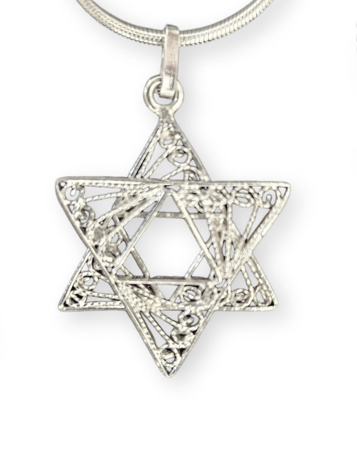 Sterling silver filigree Star of David pendant on a snake chain, shown close up