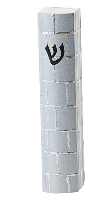Grey brick-pattern mezuzah case with a black Hebrew shin near the top