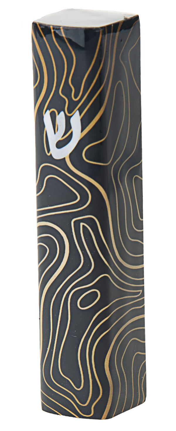 Four inch mezuzah case patterned in black and gold in an abstract design