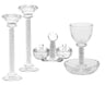 Clear crystal Shabbat set: pair of tall candlesticks, lidded salt and pepper set and Kiddush cup on a dish