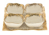 Square white porcelain serving tray with four sectioned wells and a gold rimmed edge