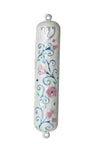 White enamel mezuzah case dotted with pink flowers and small jewels