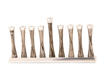Gold metal menorah formed from a single swirling line with nine candle cups