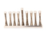 Gold metal menorah formed from a single swirling line with nine candle cups