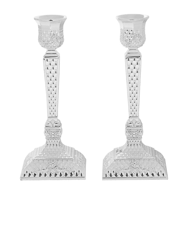 Silver plated candlestick with a diamond cut pattern covering the stem and foot