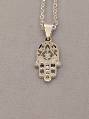 Small cut-out sterling silver hamsa with beaded fingers on a silver link chain