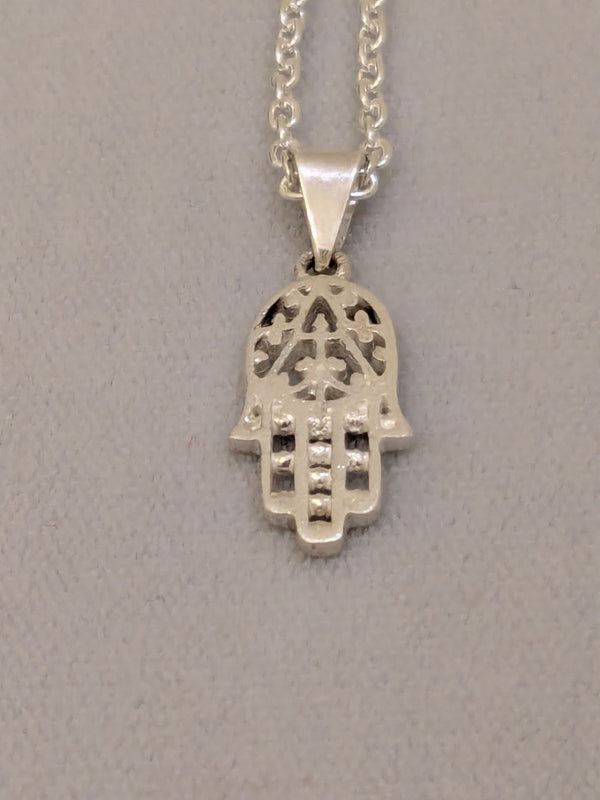 Small cut-out sterling silver hamsa with beaded fingers on a silver link chain