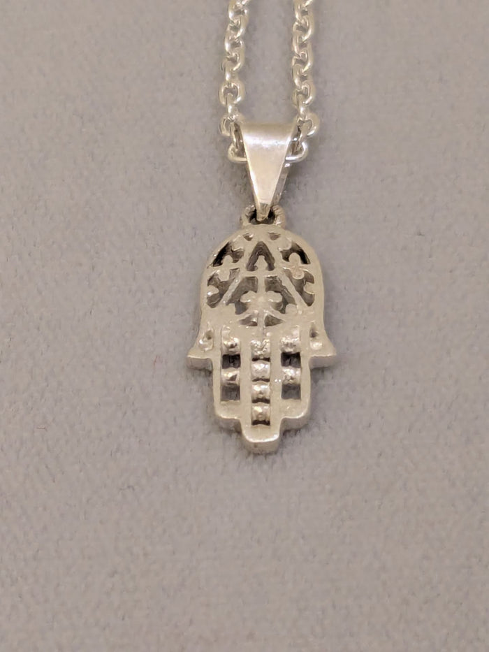Small cut-out sterling silver hamsa with beaded fingers on a silver link chain