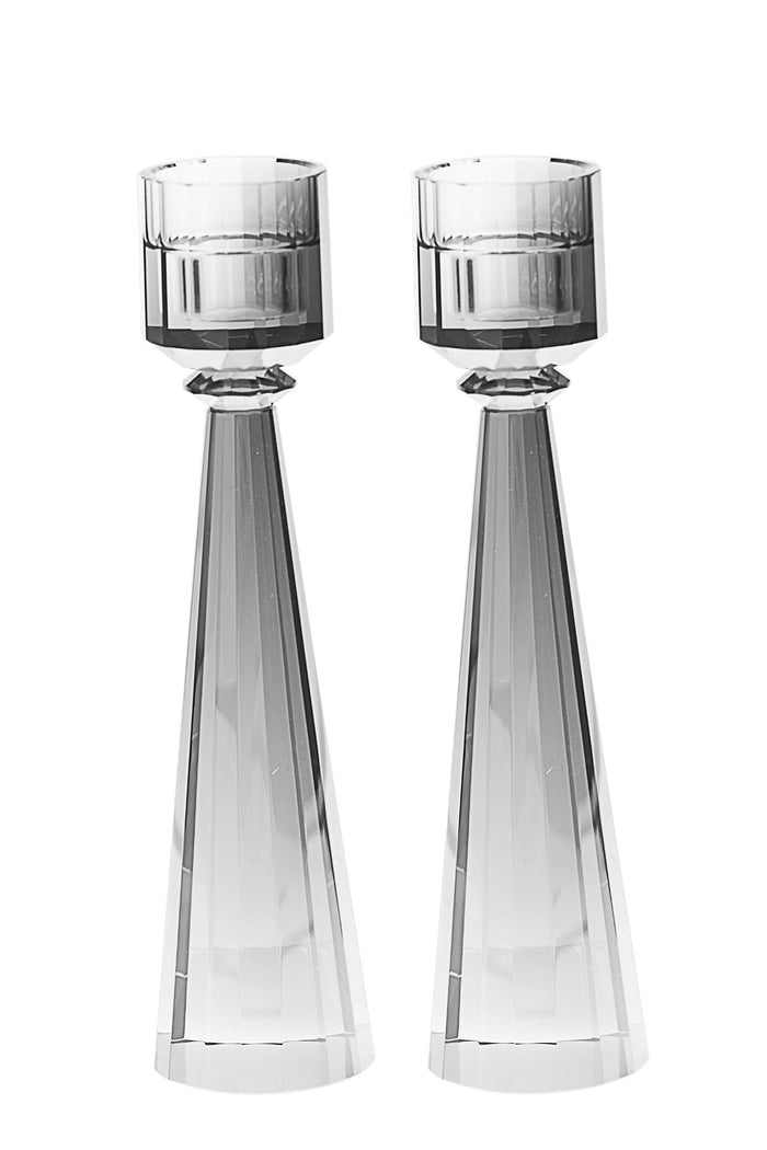 Two tall grey crystal candlesticks with faceted cone stems widening toward the base