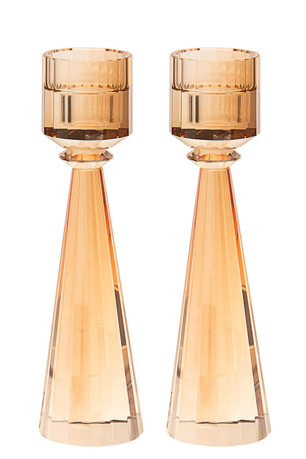Tall gold toned crystal candlestick with a cut column above a compact square base