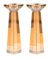 Gold toned crystal candlestick of small size with a faceted stem and square base