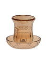 Small gold-trimmed crystal kiddush cup standing on its own round matching tray