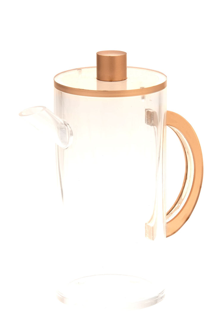 Clear Lucite oil pitcher with a copper-tone lid knob, rim and curved handle