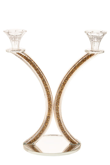 Crystal candelabra with two arms rising above a column of gold crushed stones