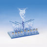 Art deco glass Chanukah menorah with three fanned panels of blue and white swirls above nine small candle cups