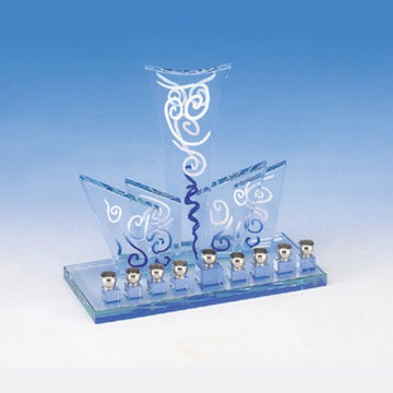 Art Deco crystal menorah with blue-tinted fan panels, white swirl design and silver-tone cups
