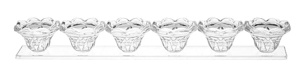 Long low clear crystal candle holder shaped for tealights with a slim rectangular body