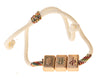 Stretch rope bracelet threaded with small mah jongg tiles around a braided cord