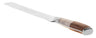 Challah knife with a swirled white and maple toned resin handle beside its long blade