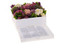White lucite bencher holder decorated with flowers and filled with upright benchers